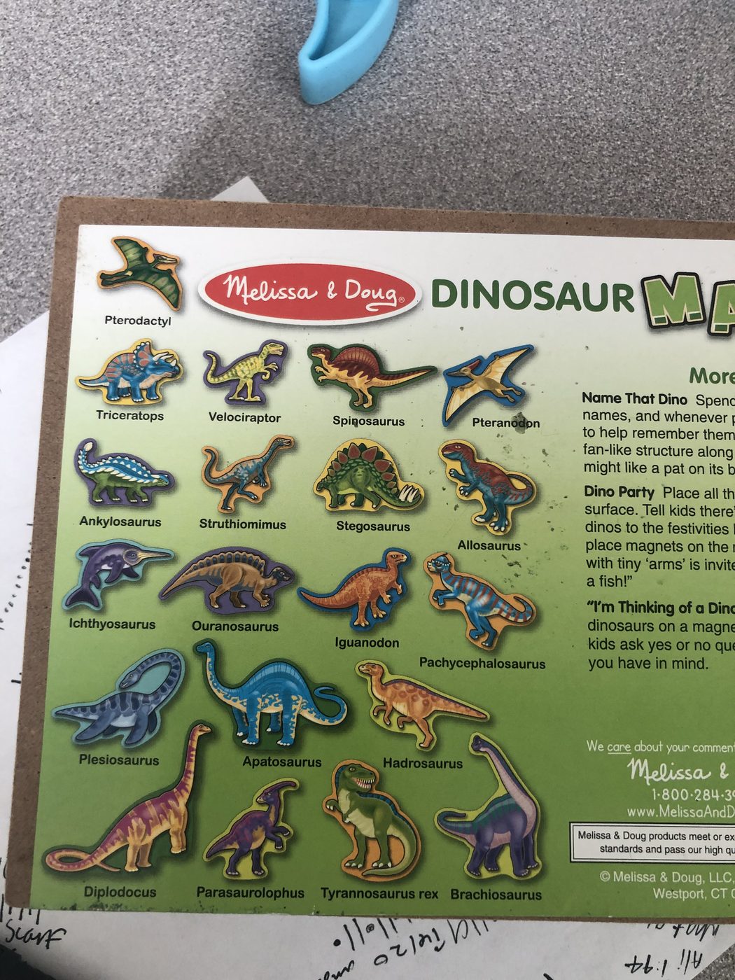 A wooden dinosaur puzzle used during a speech and language session
